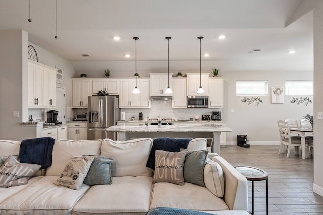 512 Bell Boot Pass, Georgetown, TX 78626 - living room with recessed lighting, baseboards, and wood finished floors