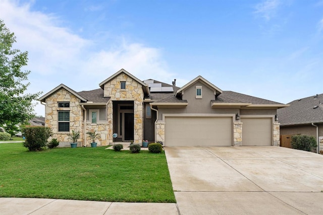 512 Bell Boot Pass, Georgetown, TX 78626 - view of front of home featuring stone siding, a garage, a front yard, and roof mounted solar panels