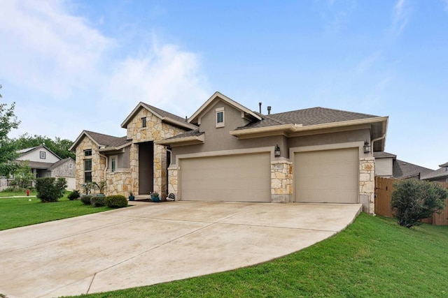 512 Bell Boot Pass, Georgetown, TX 78626 - view of front of home featuring stone siding, an attached garage, driveway, and stucco siding