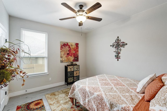 512 Bell Boot Pass, Georgetown, TX 78626 - bedroom featuring wood finished floors, baseboards, and ceiling fan