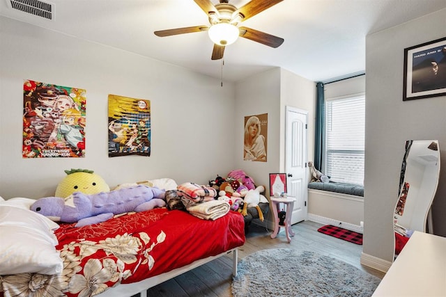 512 Bell Boot Pass, Georgetown, TX 78626 - bedroom with wood finished floors, baseboards, and a ceiling fan
