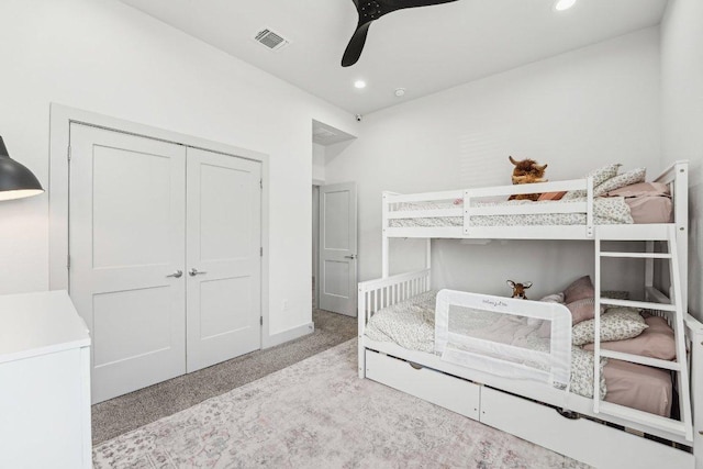 carpeted bedroom with recessed lighting, a closet, ceiling fan, and baseboards