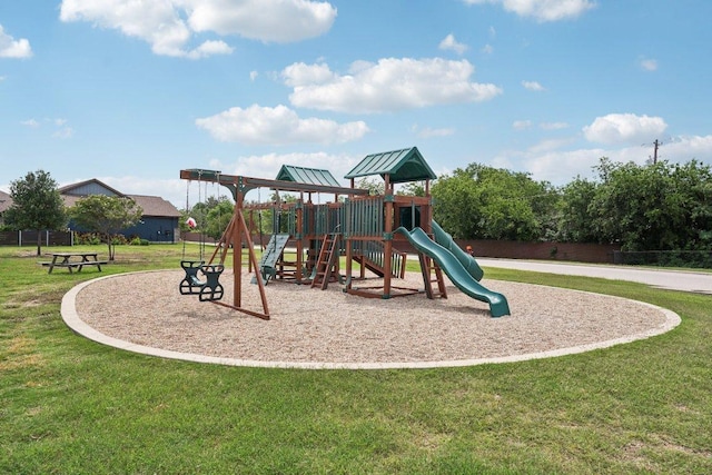 communal playground featuring a lawn