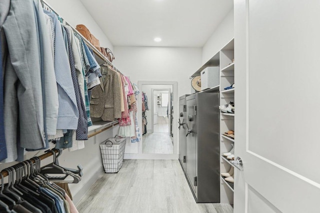 walk in closet featuring light wood finished floors