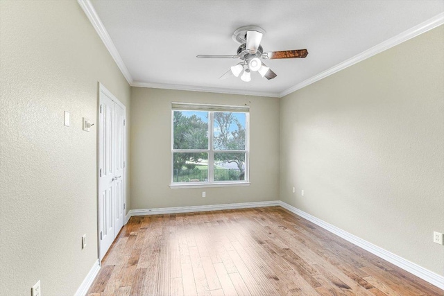 214 Yellow Rose Trl SE, Georgetown, TX 78633 - spare room with ceiling fan, light wood-style floors, a textured wall, ornamental molding, and baseboards