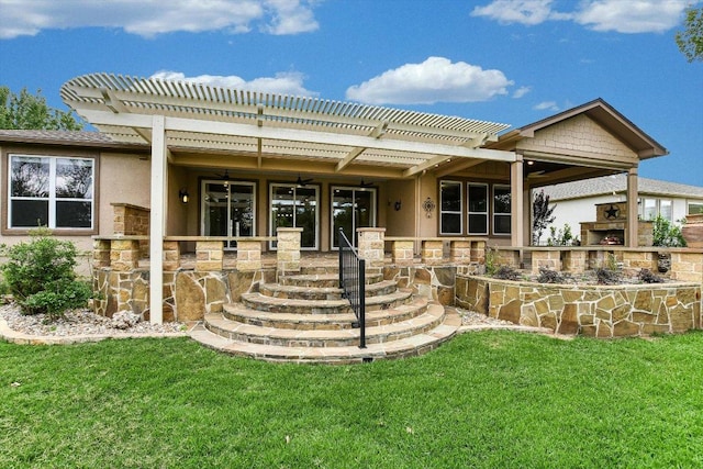 214 Yellow Rose Trl SE, Georgetown, TX 78633 - back of house featuring a pergola, a lawn, and stucco siding