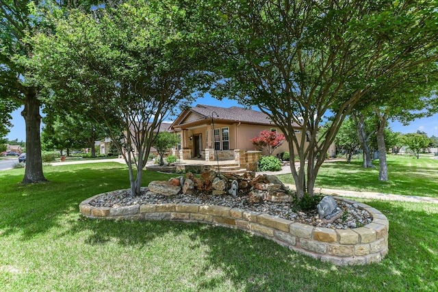 214 Yellow Rose Trl SE, Georgetown, TX 78633 - view of front of house featuring a front lawn and stucco siding