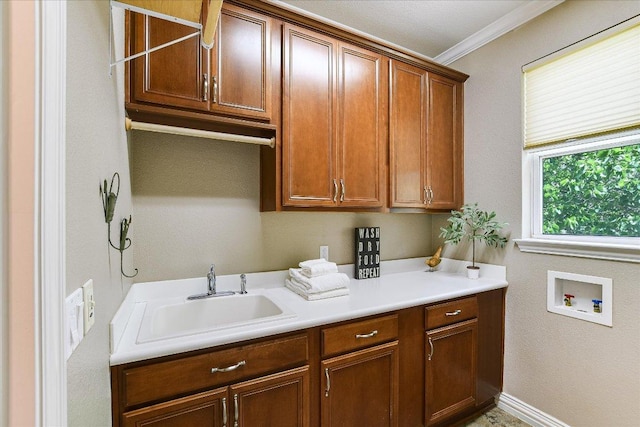 214 Yellow Rose Trl SE, Georgetown, TX 78633 - laundry area featuring hookup for a washing machine, cabinet space, ornamental molding, and baseboards