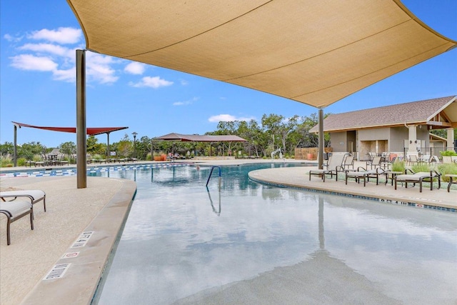 214 Yellow Rose Trl SE, Georgetown, TX 78633 - community pool featuring a patio