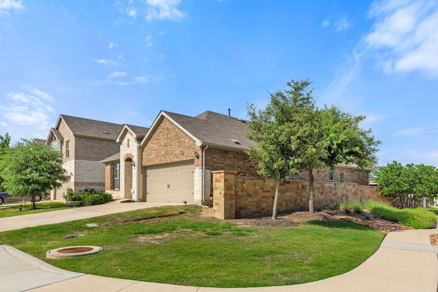 view of front facade featuring an attached garage, driveway, brick siding, and stone siding
