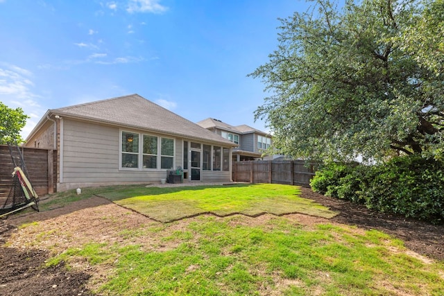 back of house with a sunroom