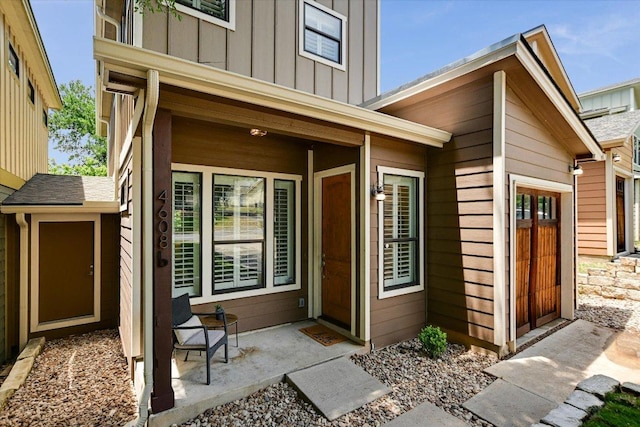 4608 Windy Brook Dr Unit B, Austin, TX 78723 - view of exterior entry with board and batten siding and covered porch