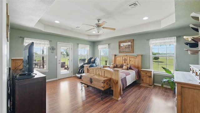 310 Hatter Dr, Moody, TX 76557 - bedroom with a raised ceiling, access to outside, wood finished floors, baseboards, and recessed lighting