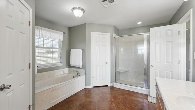 310 Hatter Dr, Moody, TX 76557 - full bath with a stall shower, vanity, a garden tub, tile patterned flooring, and baseboards