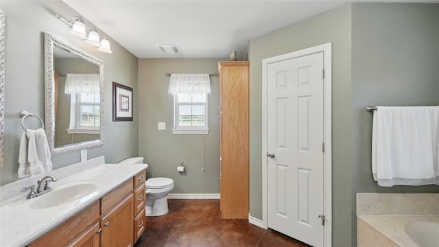310 Hatter Dr, Moody, TX 76557 - full bathroom featuring tile patterned flooring, vanity, toilet, a bathtub, and baseboards