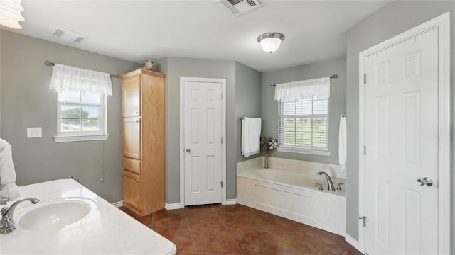 310 Hatter Dr, Moody, TX 76557 - bathroom featuring healthy amount of natural light, tile patterned flooring, a bath, and vanity