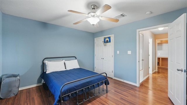 310 Hatter Dr, Moody, TX 76557 - bedroom with wood finished floors, baseboards, a closet, and ceiling fan