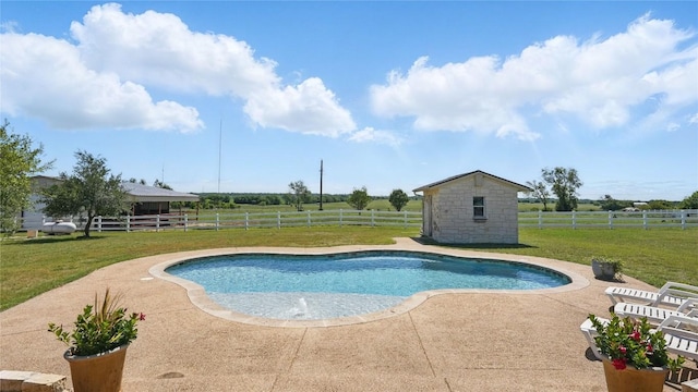 310 Hatter Dr, Moody, TX 76557 - view of swimming pool featuring an outbuilding, a patio area, a rural view, and a storage shed