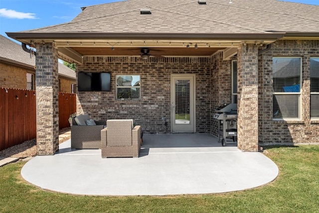 view of patio / terrace with ceiling fan and fence