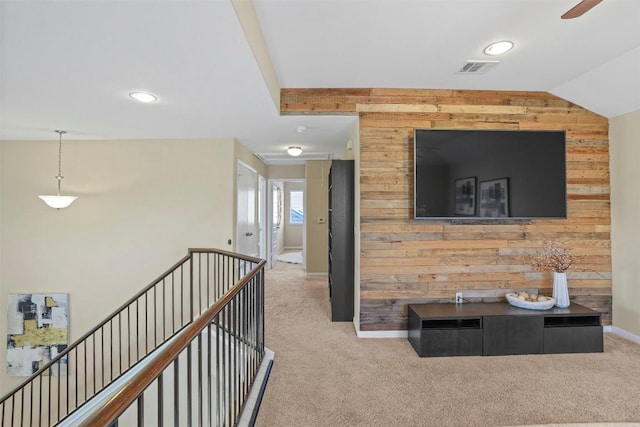 corridor featuring wooden walls, carpet, baseboards, and recessed lighting
