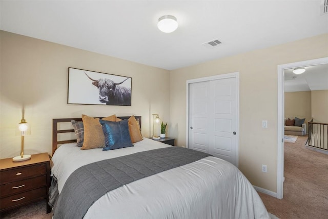 bedroom with carpet floors, a closet, and baseboards