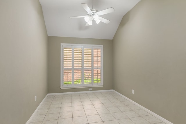 unfurnished room featuring a ceiling fan, vaulted ceiling, baseboards, and light tile patterned flooring