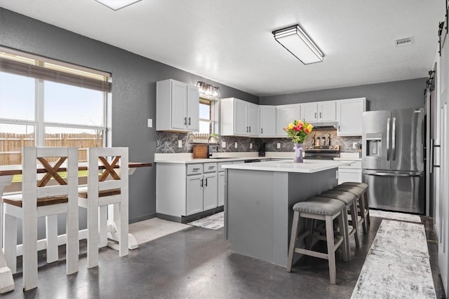 407 Osman Dr, Killeen, TX 76542 - kitchen featuring stainless steel appliances, backsplash, finished concrete flooring, and a sink