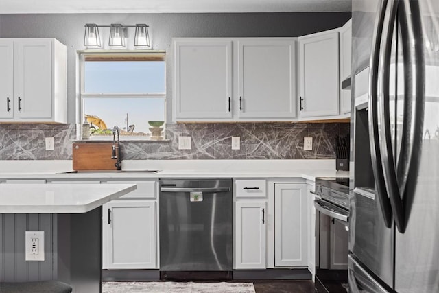 407 Osman Dr, Killeen, TX 76542 - kitchen featuring stainless steel appliances, a sink, light countertops, backsplash, and white cabinets