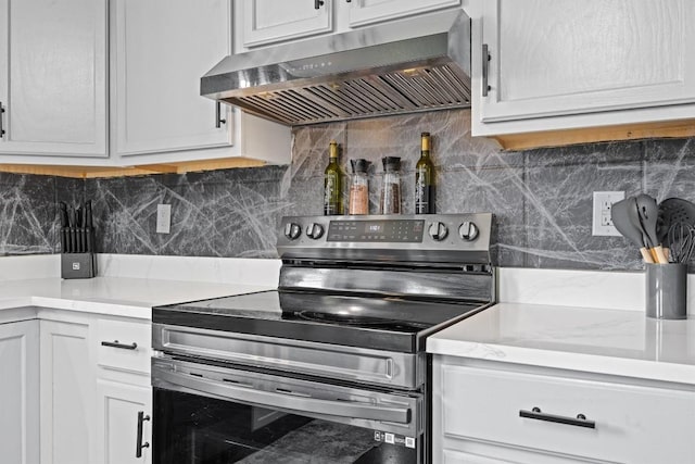407 Osman Dr, Killeen, TX 76542 - kitchen with stainless steel electric range, ventilation hood, light countertops, and tasteful backsplash