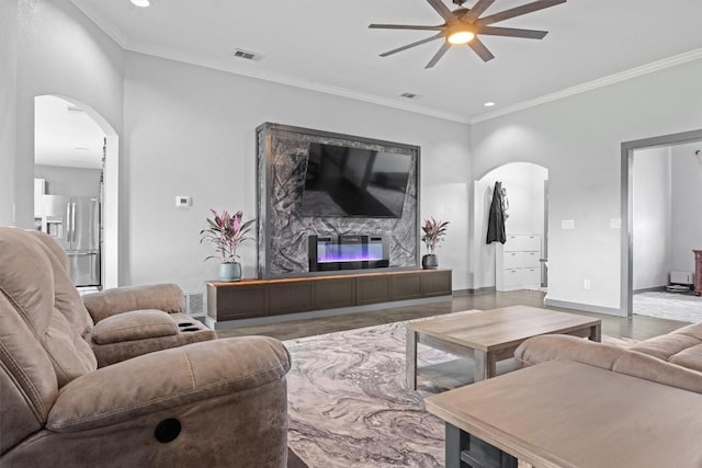 407 Osman Dr, Killeen, TX 76542 - living area featuring arched walkways, a ceiling fan, ornamental molding, baseboards, and recessed lighting
