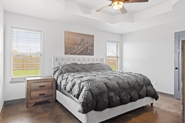 407 Osman Dr, Killeen, TX 76542 - bedroom featuring concrete floors, a raised ceiling, baseboards, and a ceiling fan