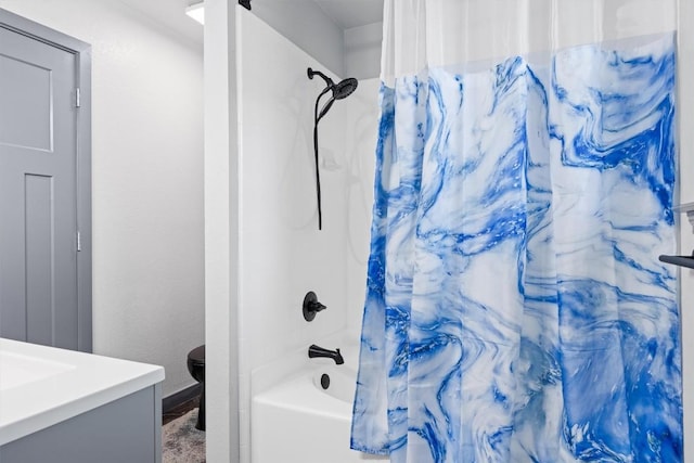 407 Osman Dr, Killeen, TX 76542 - bathroom with shower / bath combo with shower curtain, toilet, vanity, and baseboards