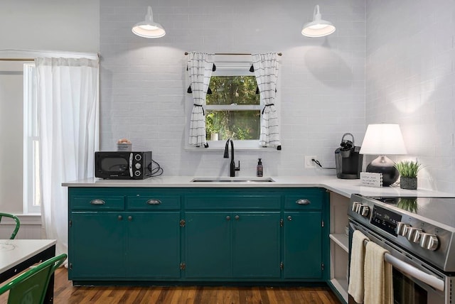 234 Loring, Stonewall, TX 78671 - kitchen with stainless steel electric stove, a sink, light countertops, and decorative backsplash