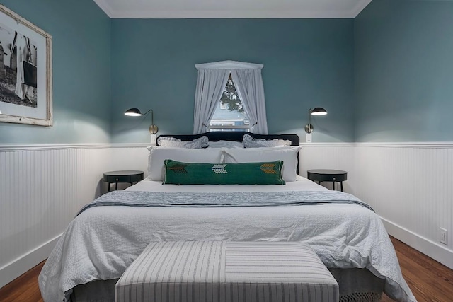 234 Loring, Stonewall, TX 78671 - bedroom with a wainscoted wall, wood finished floors, ornamental molding, and baseboards