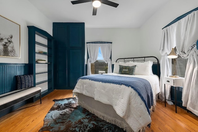 234 Loring, Stonewall, TX 78671 - bedroom with light wood-style flooring and a ceiling fan