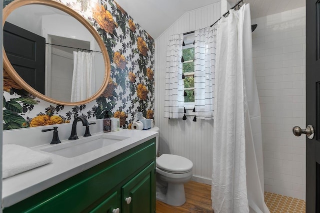 234 Loring, Stonewall, TX 78671 - full bath with vanity, wallpapered walls, vaulted ceiling, a tile shower, and toilet