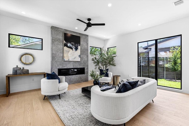 5409 Ave G Ave, Austin, TX 78751 - living area with a high end fireplace, recessed lighting, wood finished floors, and ceiling fan