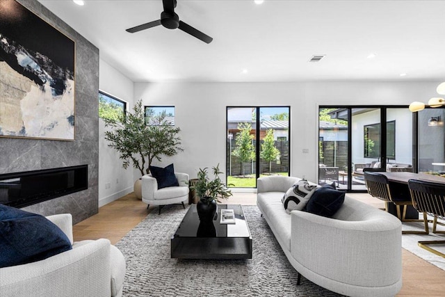 5409 Ave G Ave, Austin, TX 78751 - living area with a ceiling fan, recessed lighting, wood finished floors, and a premium fireplace