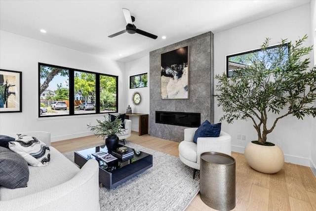 5409 Ave G Ave, Austin, TX 78751 - living area featuring plenty of natural light, a fireplace, ceiling fan, wood finished floors, and recessed lighting