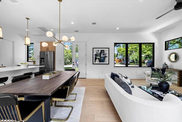 5409 Ave G Ave, Austin, TX 78751 - living area with plenty of natural light, light wood finished floors, recessed lighting, and a chandelier