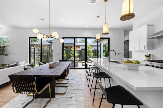 5409 Ave G Ave, Austin, TX 78751 - dining room with recessed lighting, a chandelier, and light wood-style floors