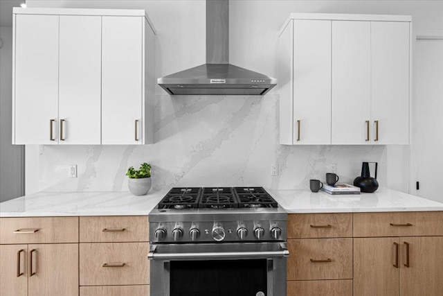 5409 Ave G Ave, Austin, TX 78751 - kitchen with wall chimney range hood, gas stove, light stone counters, and backsplash