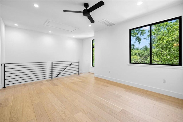5409 Ave G Ave, Austin, TX 78751 - spare room featuring attic access, a ceiling fan, healthy amount of natural light, wood finished floors, and recessed lighting