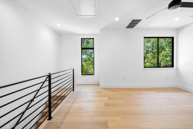 5409 Ave G Ave, Austin, TX 78751 - empty room with light wood finished floors, baseboards, recessed lighting, and attic access