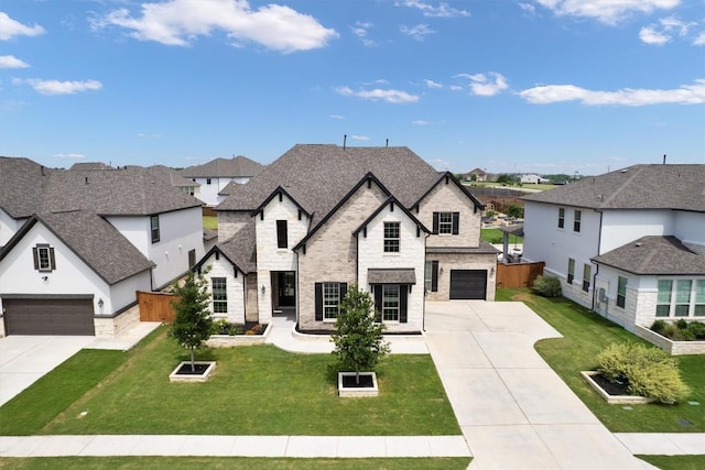 4916 Risana Bnd, Round Rock, TX 78665 - french provincial home featuring a residential view, stone siding, and driveway