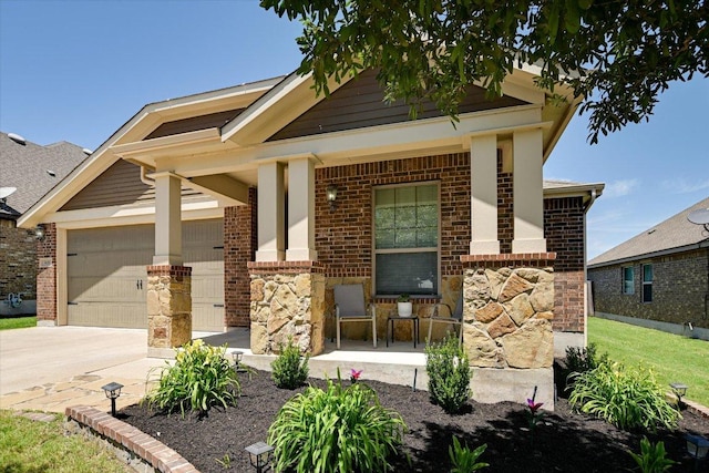 5659 Corsica Loop, Round Rock, TX 78665 - view of front of home with brick siding, driveway, stone siding, and an attached garage