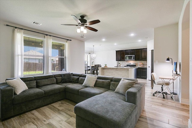 5659 Corsica Loop, Round Rock, TX 78665 - living room featuring light wood-type flooring, ceiling fan, and recessed lighting