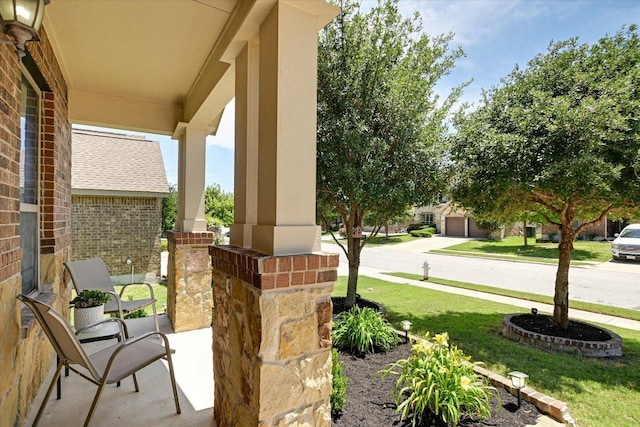 5659 Corsica Loop, Round Rock, TX 78665 - porch featuring a lawn, a garage, and driveway