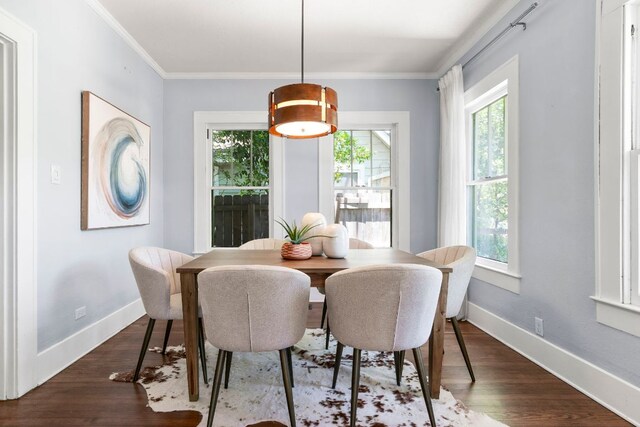 4536 Duval St Unit 2, Austin, TX 78751 - dining space with healthy amount of natural light, dark wood-style flooring, and crown molding