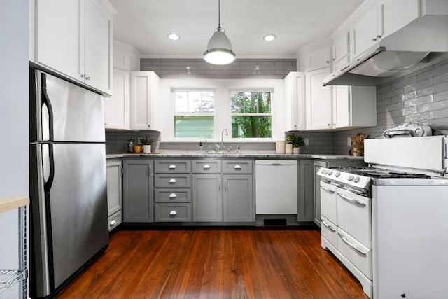 4536 Duval St Unit 2, Austin, TX 78751 - kitchen featuring white appliances, under cabinet range hood, gray cabinets, backsplash, and dark wood-style flooring